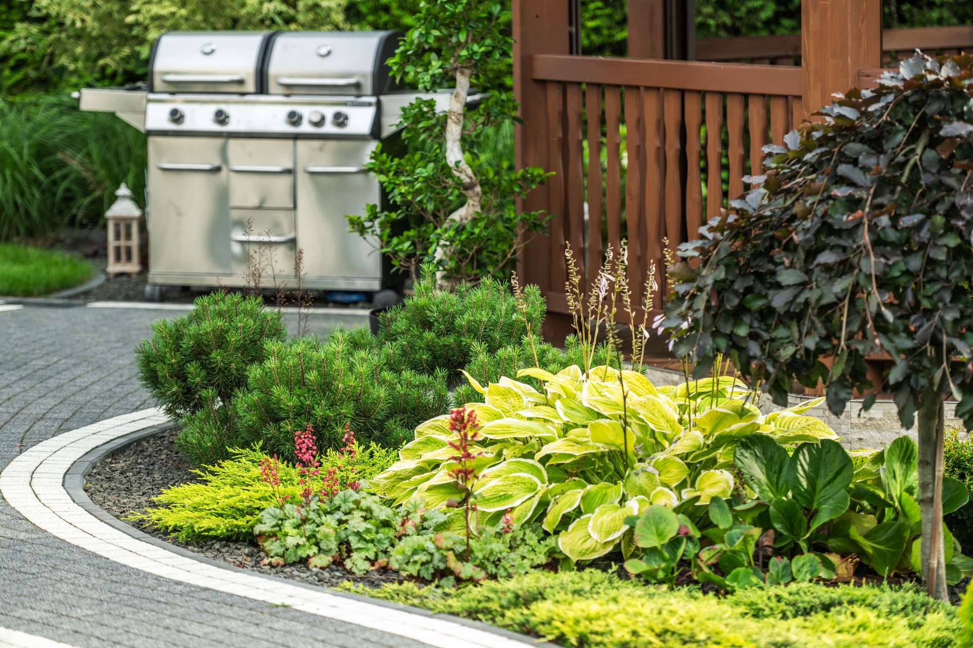 Lush Garden Landscape Featuring Grill Setup in a Backyard